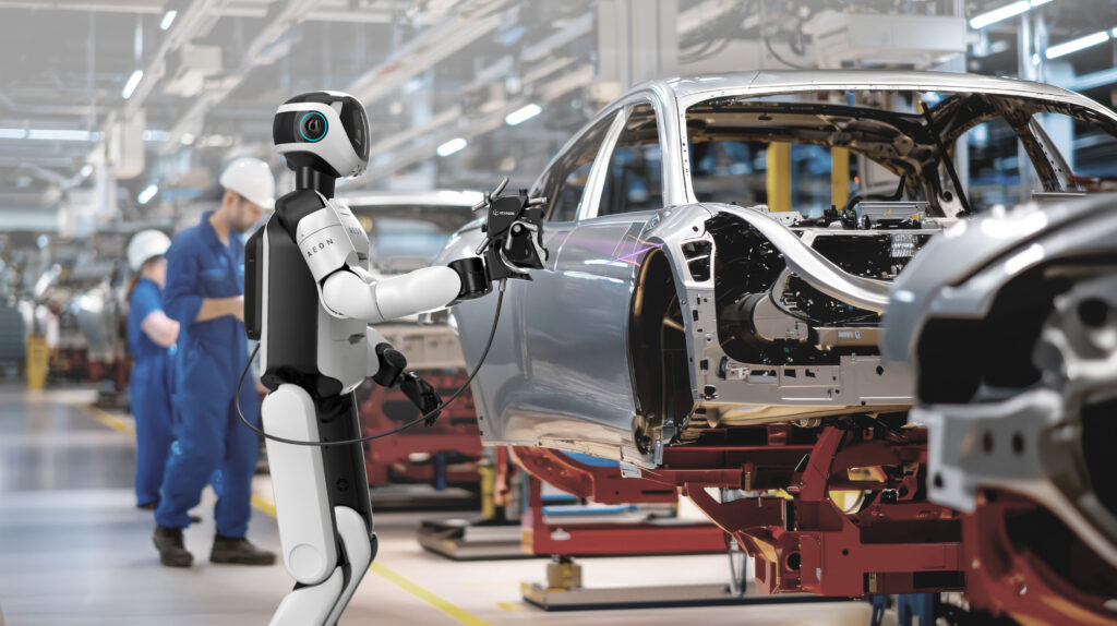 AEON robot working in an automotive manufacturing facility, scanning with AS1 scanner.
