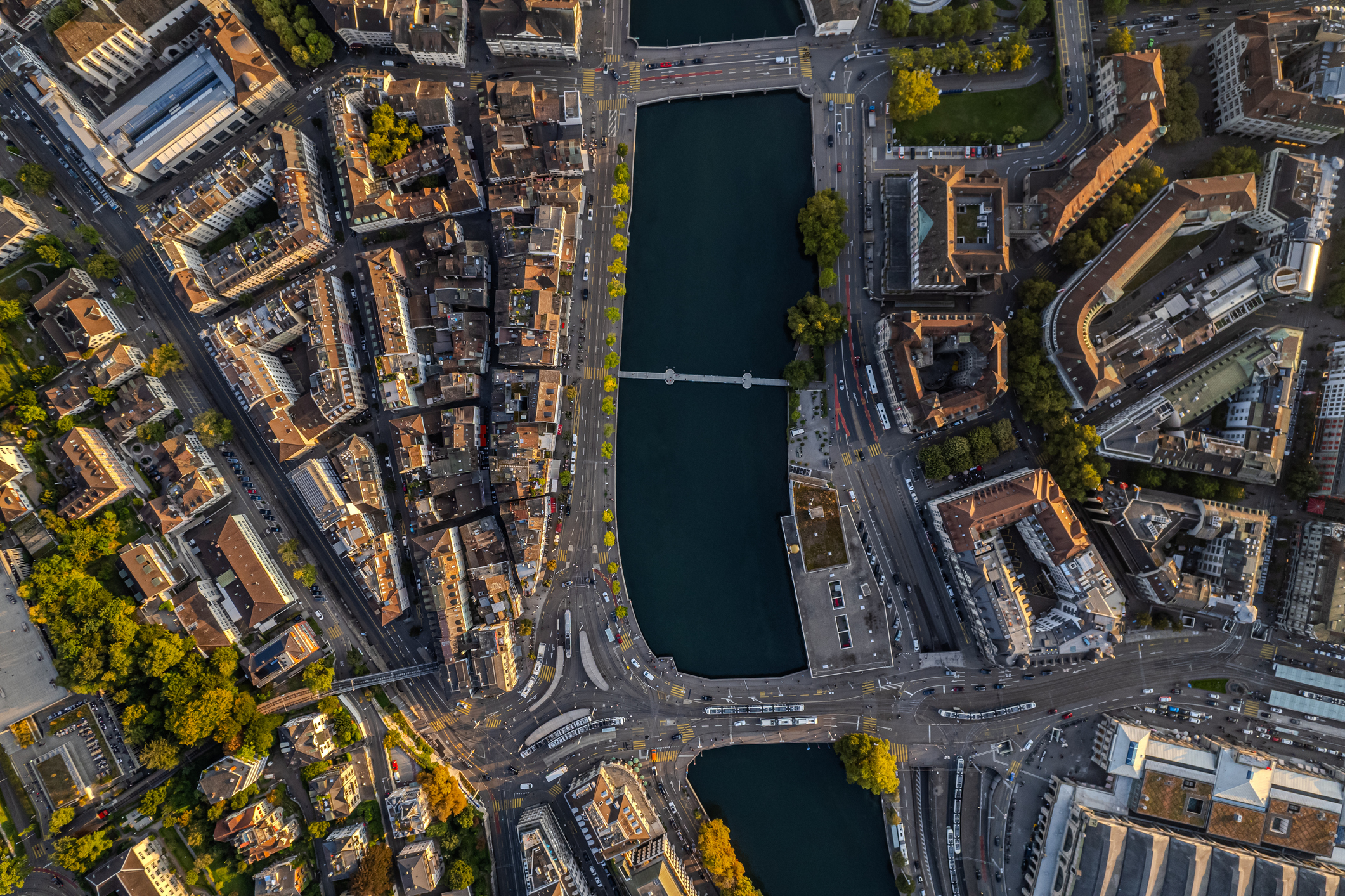 Beautiful aerial view of the city of Zurich in Switzerland - the Limmat River and its iconic churches, buildings rivers and Clockes.