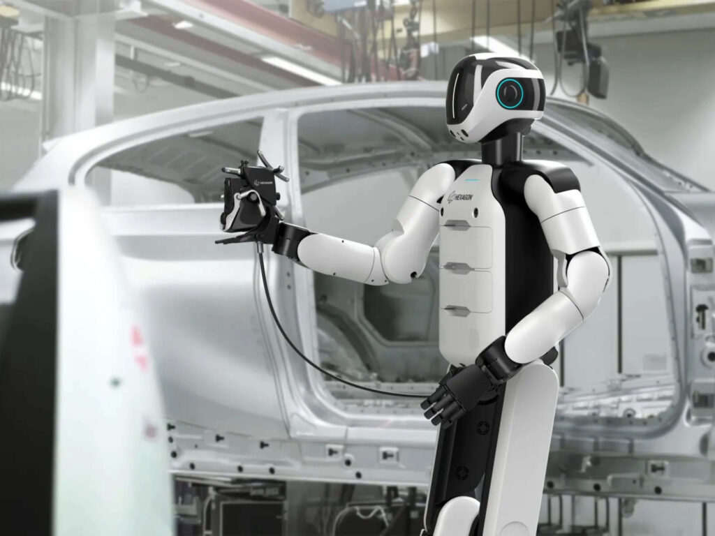 AEON inspecting car pieces at a factory